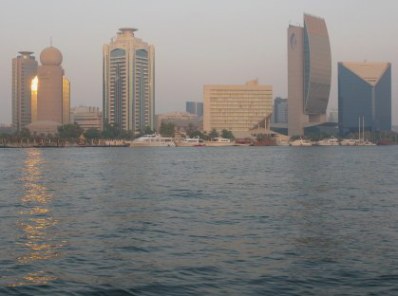 Etisilat Tower with golden sunset reflections from Dubai Creek Etisilat Tower with golden sunset reflections from Dubai Creek