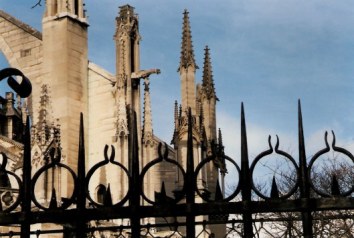 Gargoyles from behind wrought iron fence - Notre Dame Cathedral - Paris Gargoyles from behind wrought iron fence - Notre Dame Cathedral - Paris