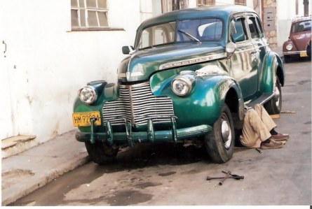 Havana-classic-car-with-repairman-underneath Havana-classic-car-with-repairman-underneath