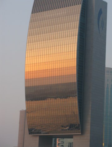 Sunset reflections on the National Bank of Dubai from Dubai Creek Sunset reflections on the National Bank of Dubai from Dubai Creek