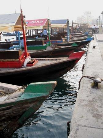 Traditional wooden dhows abras or water taxis on Dubai Creek Traditional wooden dhows abras or water taxis on Dubai Creek