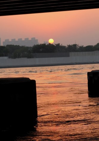 Under-bridge sunset outlines Dubai Creek Under-bridge sunset outlines Dubai Creek