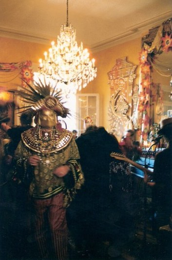 Exotic figure at French Quarter balcony party during New Orleans Mardi Gras