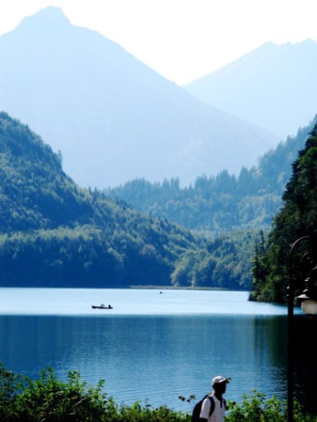 Hiker and canoe Alpensee Hohenschwangau Bavaria