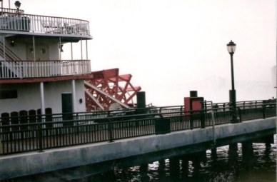 Paddle steamer and bridge in fog New Orleans