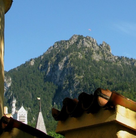 Paraglider over Neuschwanstein Castle in Bavaria