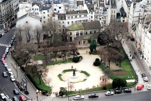 View of neighbourhood square below from Notre Dame Cathedral Paris View of neighbourhood square below from Notre Dame Cathedral Paris