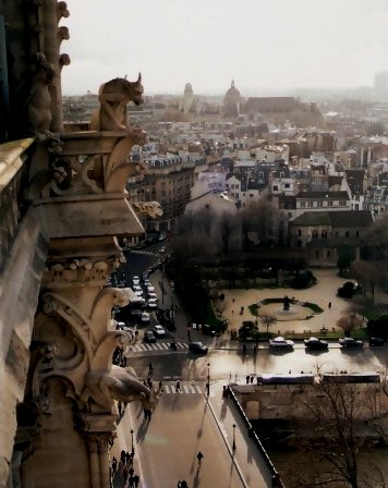 Notre Dame Cathedral Tower Gargoyle overlooking local park Paris Notre Dame Cathedral Tower Gargoyle overlooking local park Paris