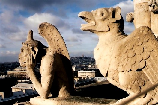 Gargoyle and Stone Bird on Notre Dame Cathedral Tower Gargoyle and Stone Bird on Notre Dame Cathedral Tower