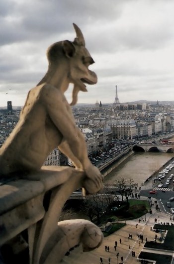 Gargoyle overlooking the River Seine Notre Dame Cathedral Paris Gargoyle overlooking the River Seine Notre Dame Cathedral Paris