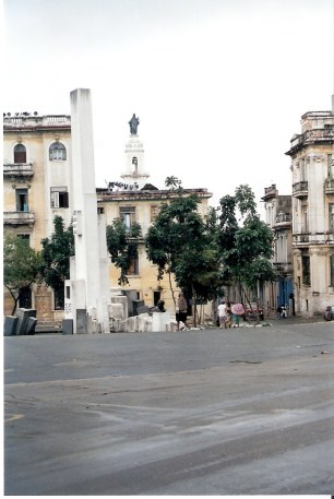 Satue of Holy Mother with Havana Capitol Dome in distance