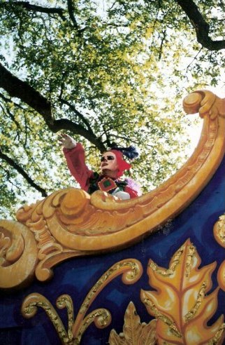 Throwing beads New Orleans Mardi Gras