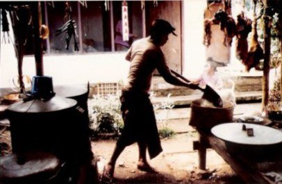 Bali village wedding feast rice on shovel