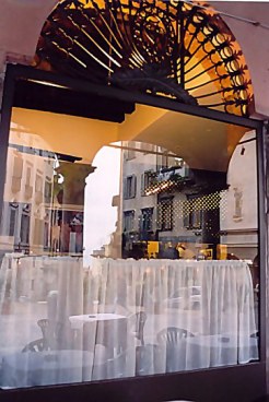 Bergamo Alta reflected in café