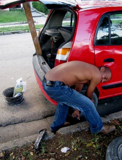 Changing tyre in Havana Cuba