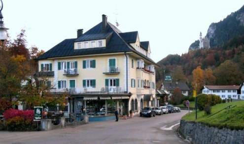 Cleaning streets outside Hotel Muller Hohenschwangau Bavaria