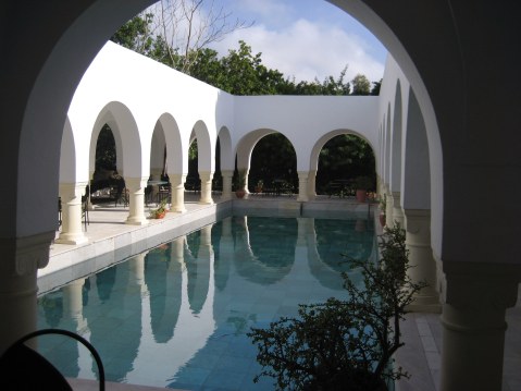 Colonnades around pool Dar Sebastian Hammamet Tunisia