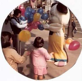 Costumed dog with balloons in Tokyo 