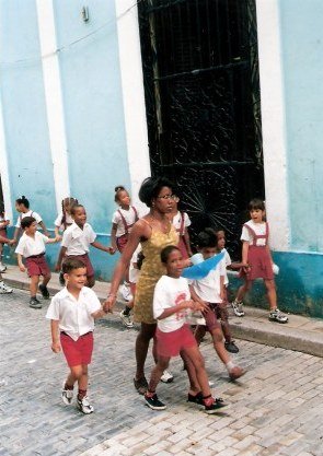 Cuban school chidren with teacher in Havana