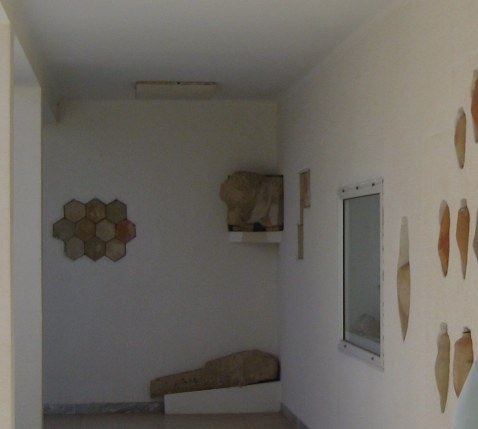 Display of pottery in museum at ruins of Kerkouane