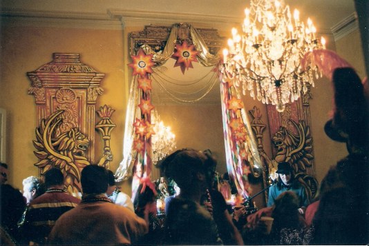 Elegant interior of French Quarter balcony party during New Orleans Mardi Gras