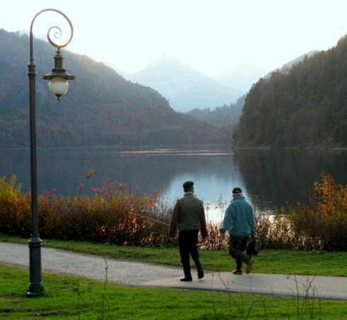 Fishermen arriving at Autumn beside Alpsee Hohenschwangau