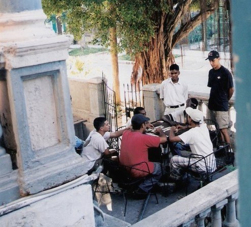 Game of Dominoes on verandah in Havana, Cuba