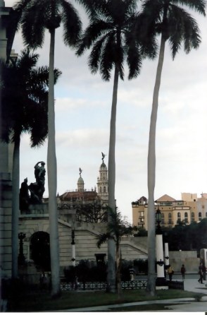 Havana Angel Of Gran Teatro Being Watched By Bronze Man