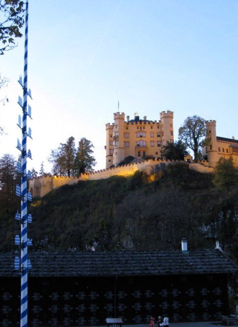 Hohenschwangau Castle and Maypole at dusk 