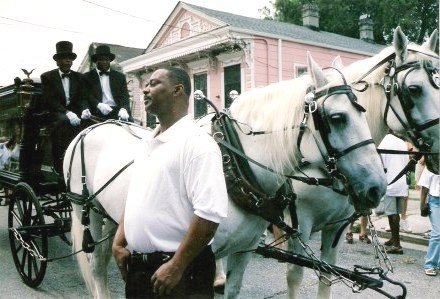 Horse-drawn hearse at Jazz Funeral New Orleans
