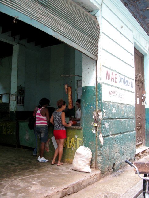 Meat hanging at a state food store Havana Cuba