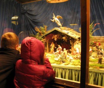 Munich Christmas Market children gazing at the nativity crib