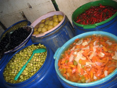Pickled vegetables in blue tubs
