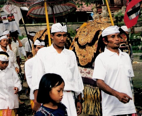 Serious marchers in ceremonial procession at Village of White Herons in Bali