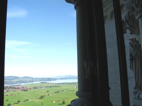 View guarded by statue of Holy Mother from Neuschwanstein Castle Bavaria