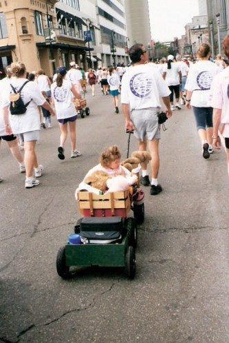 Walkers with children in wagons in the New Orleans Marathon